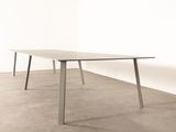 an image of a table with a white top and metal legs