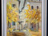 une peinture à l'huile représentant une fontaine devant un immeuble