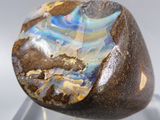a large rock with a blue and white design on it