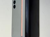 a picture of a cell phone hanging on a wall