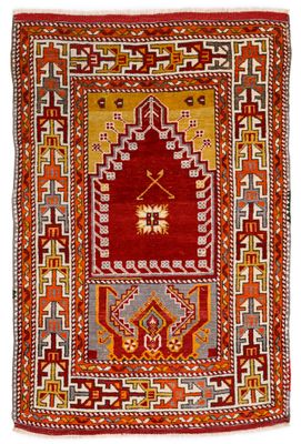 a red and yellow rug with a geometric design