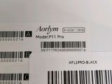 the back side of a white laptop with a barcode on it