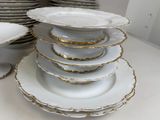 a lot of plates stacked on top of each other on a table