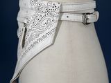 a close up of a mannequin torso with a belt on it