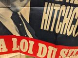 a large poster of a man in a suit and tie