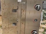 an image of a stainless steel grill with a lot of rust on it