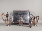 a silver tray with a tray of silver items on it