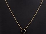 a gold necklace with a black stone pendant on a mannequin neck