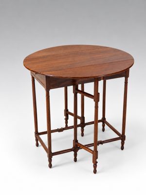 a round table with two legs and a wooden top
