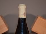 a bottle of wine that is sitting on a table