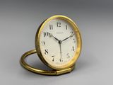 a small clock that is sitting on a table