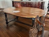 a wooden table with a bag on it in a room