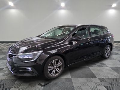 the black volkswagen e - golf is parked on a checkered tile floor
