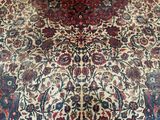 an image of a large oriental rug on a wooden floor