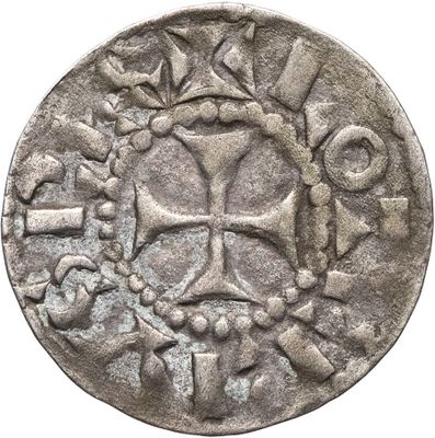 une image représentant une pièce d'argent sur laquelle figure une croix