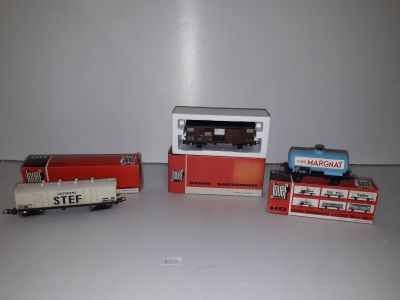 three toy trains that are sitting on a table