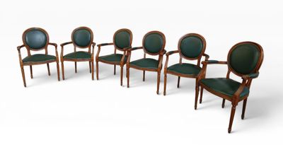 set of six chairs with green upholstered leather seats