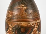 a vase with a design on it on a white background