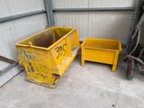 two yellow bins are sitting next to each other in a garage