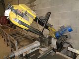 a picture of a machine that is cutting a piece of wood