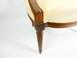une image représentant une chaise dont l'assise est recouverte d'un tissu beige