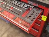 some tools are sitting on top of a table in a garage