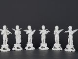 six white figurines of women with arms raised in the air