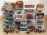 many different types of toy trains and cars on display