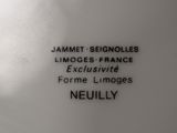 a close up of a white vase with black writing on it