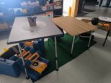 a small table with a cup on it in the middle of a room