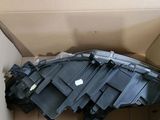 a cardboard box with a piece of black plastic inside of it