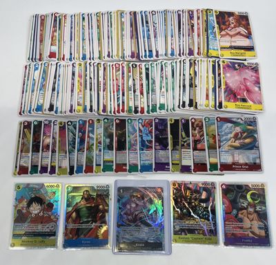 a large collection of pokemon cards are on a table