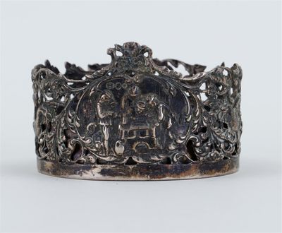 an antique silver ring with a picture of a man and a woman on it