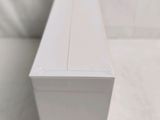 a close up of a white box on a white surface