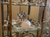 a glass display case with a lot of glass items in it