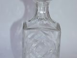 an image of a glass decanter on a white background