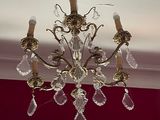 a chandelier hanging from the ceiling in a room