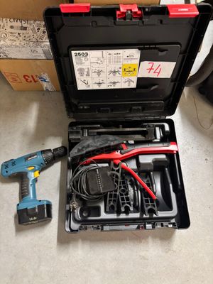 a tool kit that is sitting on the floor next to a box