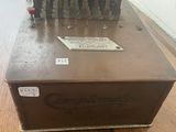 a brown box on a wooden table with a label on it
