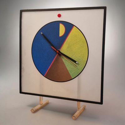 a picture of a clock that is on a stand