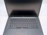 an open laptop computer sitting on top of a white table