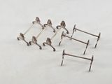 four pairs of silver plated hooks and a pair of silver plated hooks
