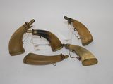 three pieces of horn horn are sitting on a white surface