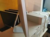a computer monitor sitting on top of a desk