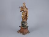 an image of a statue of a woman holding a harp