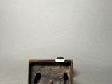 a small wooden box with a cat inside of it