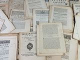 a pile of old books sitting on top of a table