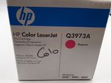 the hp color laser toner is in the box on the table