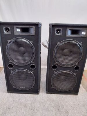 two speakers are sitting next to each other on a table