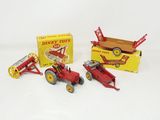 a red toy tractor and a red toy tractor and a red toy tractor and a red toy tractor and a red toy tractor and a red toy tractor